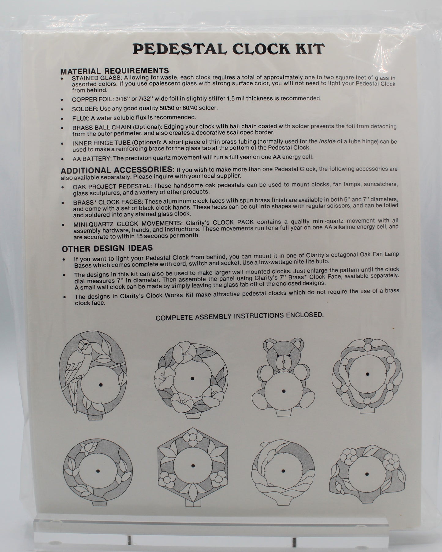 Back of a pedestal clock kit packaging with assembly instructions and diagrams.