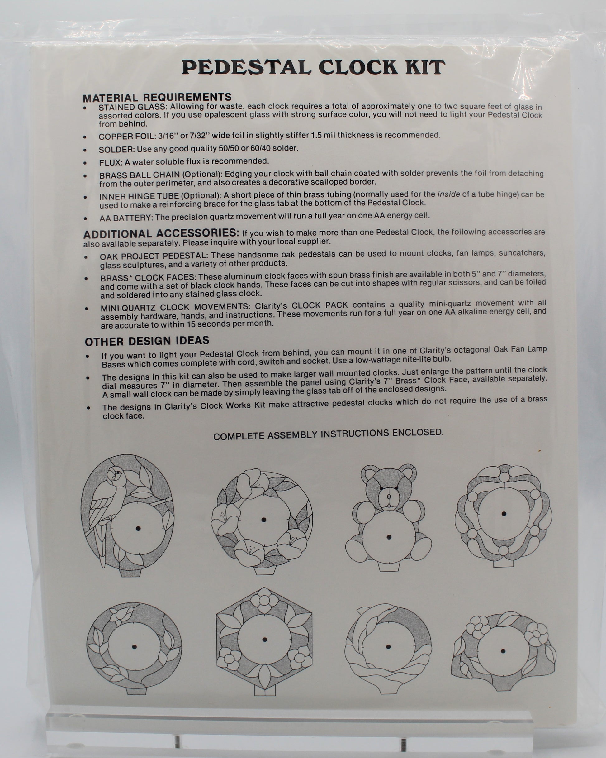 Back of a pedestal clock kit packaging with assembly instructions and diagrams.
